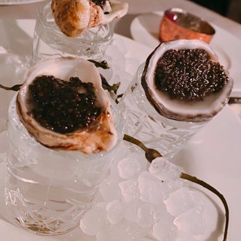 Maple & Ash - Oysters with caviar paired with vodka - Steakhouses Near Me - Chicago, Illinois Maple & Ash - Oysters with caviar paired with vodka - Steakhouses Near Me - Chicago, Illinois