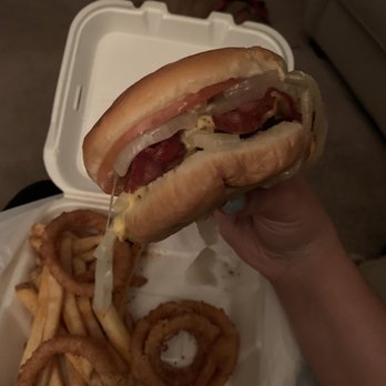 Cook Out - a person holding a hot dog and french fries - Burgers Near Me - Clarksville, Tennessee Cook Out - a person holding a hot dog and french fries - Burgers Near Me - Clarksville, Tennessee