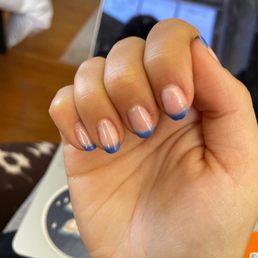 sloppy french tips and nails filed crooked, plus nail on the verge of breakage