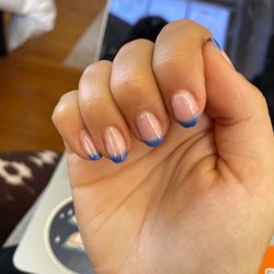 Modern Spa & Nails II - Sloppy french tips and nails filed crooked, plus nail on the verge of breakage