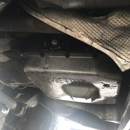 Transmission pan after picking up from Action Transmission. Still caked up with oil and dirt.