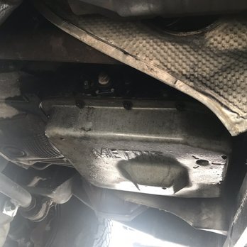 Action Transmission Specialists - Transmission pan after picking up from Action Transmission. Still caked up with oil and dirt. - Auto Repair Near Me - Jacksonville, Florida