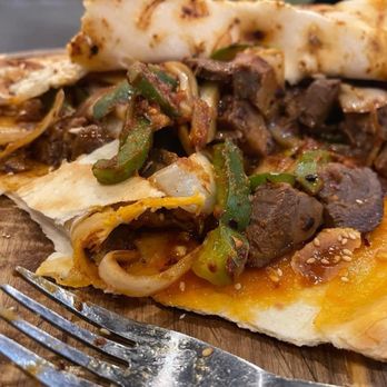 Wild Cumin - A peek inside the lamb shank naan. - Asian Fusion Near Me - Kent, Washington