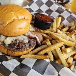Poor Richard’s Public House - Bacon & Brie Burger House-made bacon & creamy brie With a side of Morito BBQ- not pictured apple fennel slaw.