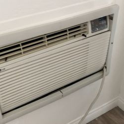 Sycamore Hills Village Apartments - A/C in living room behind door.