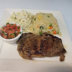 Sabor Latino Cafe & Pupuseria - Grilled steak. Rice pasta salad and chimol