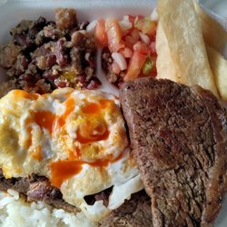 The Corn House - Brazilian Platter with sirloin steak,white rice over pinto beans topped with a fried egg.