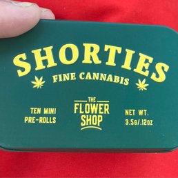 Their house brand tin of pre-rolls, "shorties" Their house brand tin of pre-rolls, "shorties"