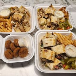 Damascus City Food - All four dishes, chicken plates at the top, beef bottom right, falafel bottom left.