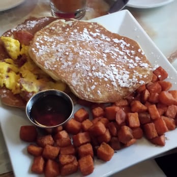 Lucky's Lounge - Double Dynamite (cheddar & bacon scrambled eggs between two flapjacks with maple syrup, sweet cream butter & choice of potato) - Lounges Near Me - Boston, Massachusetts Lucky's Lounge - Double Dynamite (cheddar & bacon scrambled eggs between two flapjacks with maple syrup, sweet cream butter & choice of potato) - Lounges Near Me - Boston, Massachusetts