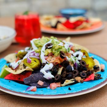 Lakeview Cantina - Traditional Nachos & Cheese with seasoned beef, black beans, tomatoes, black olives, jalapenos, and sour cream - Mexican Near Me - Wheeling, West Virginia