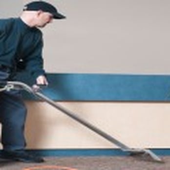 Michigan Restoration & Cleaning - a man using a vacuum - Carpet Cleaning Near Me - Highland, Michigan Michigan Restoration & Cleaning - a man using a vacuum - Carpet Cleaning Near Me - Highland, Michigan