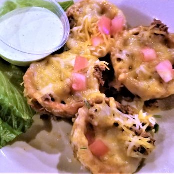 Happy Fish - Tostones Rellenos - filled with beef, has cheese on top. great appetizer - Peruvian Near Me - Tampa, Florida Happy Fish - Tostones Rellenos - filled with beef, has cheese on top. great appetizer - Peruvian Near Me - Tampa, Florida