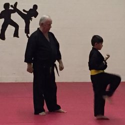 Bradley Karate Studio - Bradley Karate Studio - Grandmaster  overseeing a young students kata