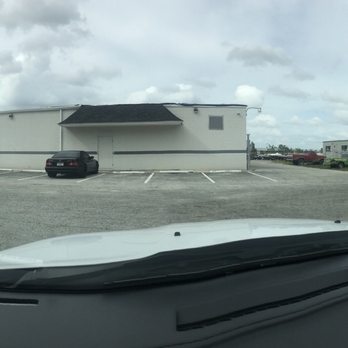 Premier Pool Enclosures - The facility warehouse on the left with all the material Inside and the office to the right in the trailer at the address - Roofing Near Me - Fort Myers, Florida Premier Pool Enclosures - The facility warehouse on the left with all the material Inside and the office to the right in the trailer at the address - Roofing Near Me - Fort Myers, Florida
