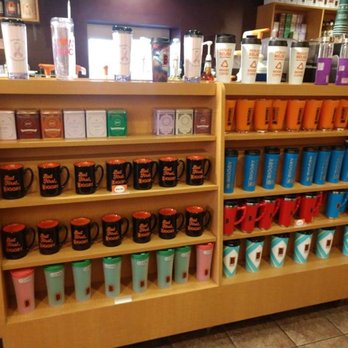 BIGGBY COFFEE - a shelf full of coffee mugs - Coffee & Tea Near Me - Toledo, Ohio