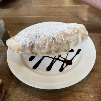 Panini's Italian Cucina - Nutella calzone crunchy and warm perfect to share. - Pizza Near Me - Edmonton, Alberta Panini's Italian Cucina - Nutella calzone crunchy and warm perfect to share. - Pizza Near Me - Edmonton, Alberta