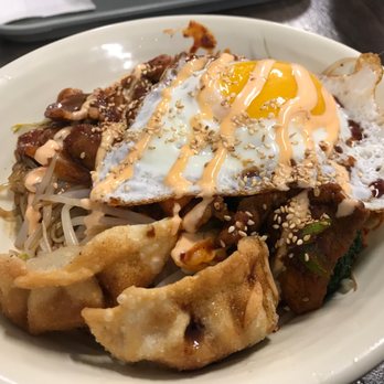 Varsity - a plate of asian food on a table - Korean Near Me - Toronto, Ontario Varsity - a plate of asian food on a table - Korean Near Me - Toronto, Ontario