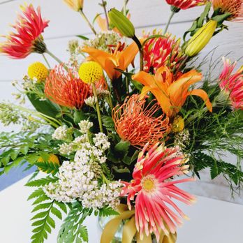 The Golden Pothos - Tropical mix bouquet, Mixed flowers that gives a exotic feel. - Florists Near Me The Golden Pothos - Tropical mix bouquet, Mixed flowers that gives a exotic feel. - Florists Near Me