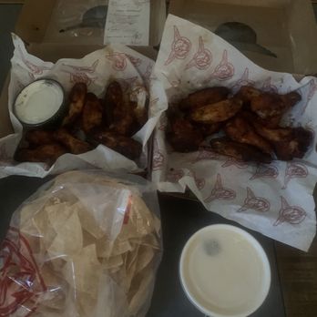 Taco Mac - This is the entire order that cost almost $80 after tip. The fries are missing. - Sports Bars Near Me - Buford, Georgia