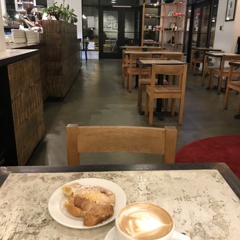 Dubsea Coffee - Interior, and an almond croissant and cardamom latte - Coffee & Tea Near Me - Seattle, Washington Dubsea Coffee - Interior, and an almond croissant and cardamom latte - Coffee & Tea Near Me - Seattle, Washington