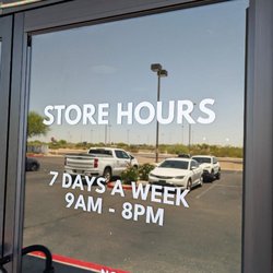 JVapes Vape & Smoke Shop - Exterior - Door with store hours