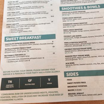 Roost - Menu - The menu from Roost restaurant displays sections for breakfast, toasts & oats, smoothies & bowls, and sides. It lists items such as English muffin breakfast, avocado toast, smoothie bowls, and side dishes like fries and breakfast potatoes. Prices range from $5 to $15, with dietary labels like gluten-free and vegan options. The menu emphasizes food allergies and includes symbols for dietary restrictions. - Breakfast & Brunch Near Me - Fairfield, Connecticut