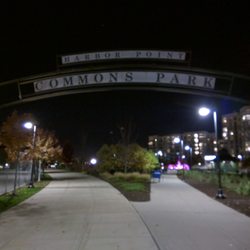 Park at night, with lit fountain in the background.
