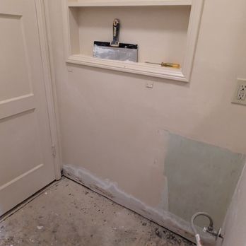 Miguel Garrido - Old baseboards removed, and walls being sanded and prepped for painting, before installing new vanity in corner - Handyman Near Me Miguel Garrido - Old baseboards removed, and walls being sanded and prepped for painting, before installing new vanity in corner - Handyman Near Me
