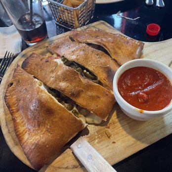 Slice 19 - Calzone which was huge and good. - Pizza Near Me - Henderson, Nevada Slice 19 - Calzone which was huge and good. - Pizza Near Me - Henderson, Nevada