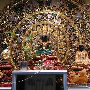 Thai Ivory Cuisine - a gold statue and a clock - Thai Near Me - Bedford, Nova Scotia Thai Ivory Cuisine - a gold statue and a clock - Thai Near Me - Bedford, Nova Scotia
