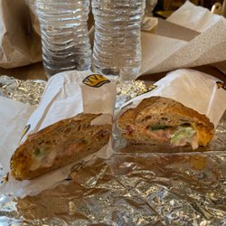 Which Wich Superior Sandwiches - Custom Sandwich: Regular, Wheat, Cheddar (Double), Bell Peppers, Red Onions, Tomatoes, Mayo, Thousand Island, Vinegar and Pepper.