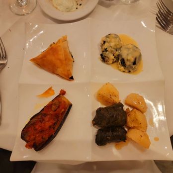 Mykonos Grill - a plate of food on a table - Greek Near Me - Rockville, Maryland