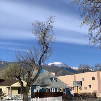 Mountain Shadows Restaurant - Front of the cafe with Pikes Peak in background.  Indoor and outdoor seating available - American Near Me - Colorado Springs, Colorado