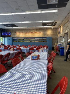 Photo of Mighty Fine Burgers - Austin, TX, US. Super cute backyard picnic interior