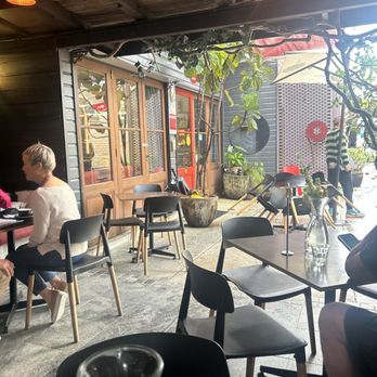 Rock & Roll Coffee Company - A seat at a table looking out towards the entry - Cafes Near Me - Mullumbimby, NSW Rock & Roll Coffee Company - A seat at a table looking out towards the entry - Cafes Near Me - Mullumbimby, NSW