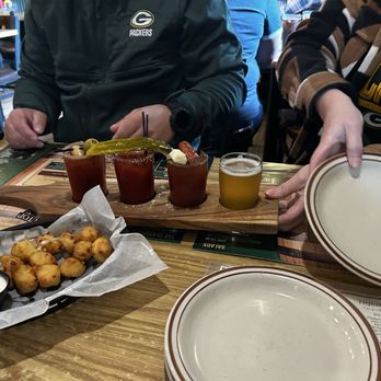 Hilltop Pub and Grill - Cheese Curds & Bloody Mary flight (garlic, dill & horseradish) - Pubs Near Me - Stevens Point, Wisconsin