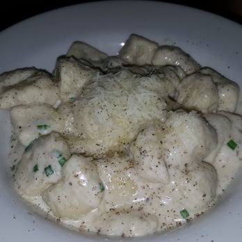 Uva - Gnocchi Di Ricotta, home made ricotta gnocchi in a creamy black truffle and chive sauce - Italian Near Me - New York, New York Uva - Gnocchi Di Ricotta, home made ricotta gnocchi in a creamy black truffle and chive sauce - Italian Near Me - New York, New York