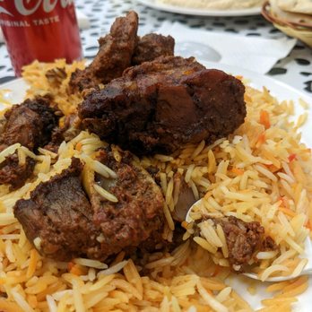 Mecca Restaurant - a plate of food with rice and meat - Mediterranean Near Me - Indianapolis, Indiana