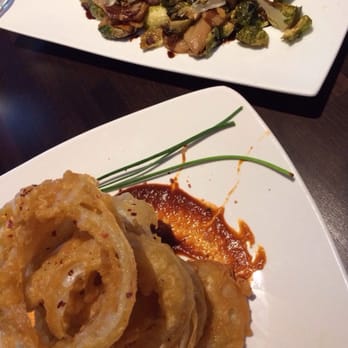Foxhole Culinary Tavern - Crispy onion rings and Brussel sprouts - New American Near Me - Austin, Texas