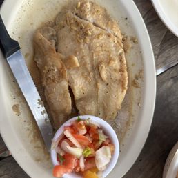 Grill fish in garlic and butter sauce.