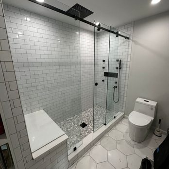 Construction Glass & Shower Doors - Look at this beautiful custom single slider shower enclosure. Get your free quote today! - Glass & Mirrors Near Me - Norcross, Georgia Construction Glass & Shower Doors - Look at this beautiful custom single slider shower enclosure. Get your free quote today! - Glass & Mirrors Near Me - Norcross, Georgia