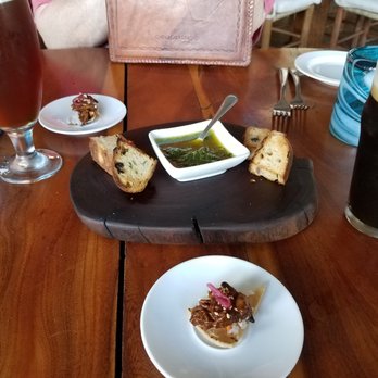 La Pintada - The complimentary starter - herb bread with pesto and a mole chicken tostada - what a great surprise! - Mexican Near Me - Cabo San Lucas, BCS La Pintada - The complimentary starter - herb bread with pesto and a mole chicken tostada - what a great surprise! - Mexican Near Me - Cabo San Lucas, BCS