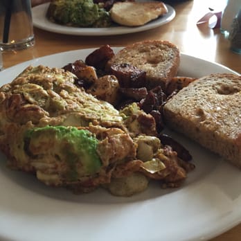 Corner Cafe - Crab meat and artichoke omelette with pesto potatoes and multigrain toast - Breakfast & Brunch Near Me - Newport, Rhode Island Corner Cafe - Crab meat and artichoke omelette with pesto potatoes and multigrain toast - Breakfast & Brunch Near Me - Newport, Rhode Island