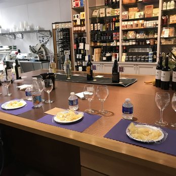 Paired, Poured & Plated - a bar with wine bottles and glasses - Cheese Shops Near Me - Northborough, Massachusetts Paired, Poured & Plated - a bar with wine bottles and glasses - Cheese Shops Near Me - Northborough, Massachusetts