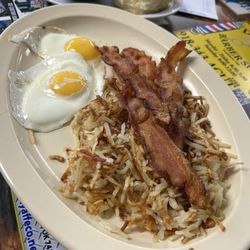 Cafe Flores - Good eggs, crispy bacon and hashbrowns. cold gravy and biscuit.