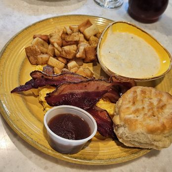 The Flying Biscuit Cafe - Pancakes side of potatoes grits cheese eggs and a biscuit - Breakfast & Brunch Near Me - Atlanta, Georgia The Flying Biscuit Cafe - Pancakes side of potatoes grits cheese eggs and a biscuit - Breakfast & Brunch Near Me - Atlanta, Georgia