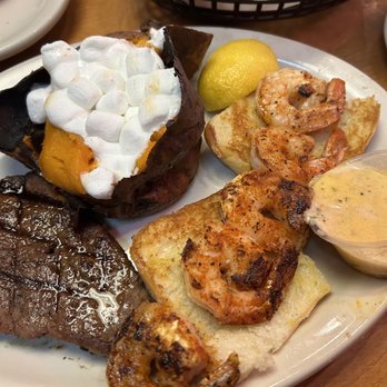 Texas Roadhouse - combo thing- 6oz sirloin (medium well) w grilled shrimp, w sides of loaded sweet potato & (not pictured) seasoned rice - American Near Me - Conroe, Texas Texas Roadhouse - combo thing- 6oz sirloin (medium well) w grilled shrimp, w sides of loaded sweet potato & (not pictured) seasoned rice - American Near Me - Conroe, Texas