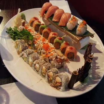 Sushi 99 - Salmon and scallop sashimi, spicy tuna and salmon pieces, crunchy roll, and salmon skin/avocado/cream cheese roll. - Sushi Bars Near Me - Port Orange, Florida Sushi 99 - Salmon and scallop sashimi, spicy tuna and salmon pieces, crunchy roll, and salmon skin/avocado/cream cheese roll. - Sushi Bars Near Me - Port Orange, Florida