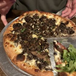 Salvatore's Tomato Pies - Woodman (with a neighboring slice of another name)